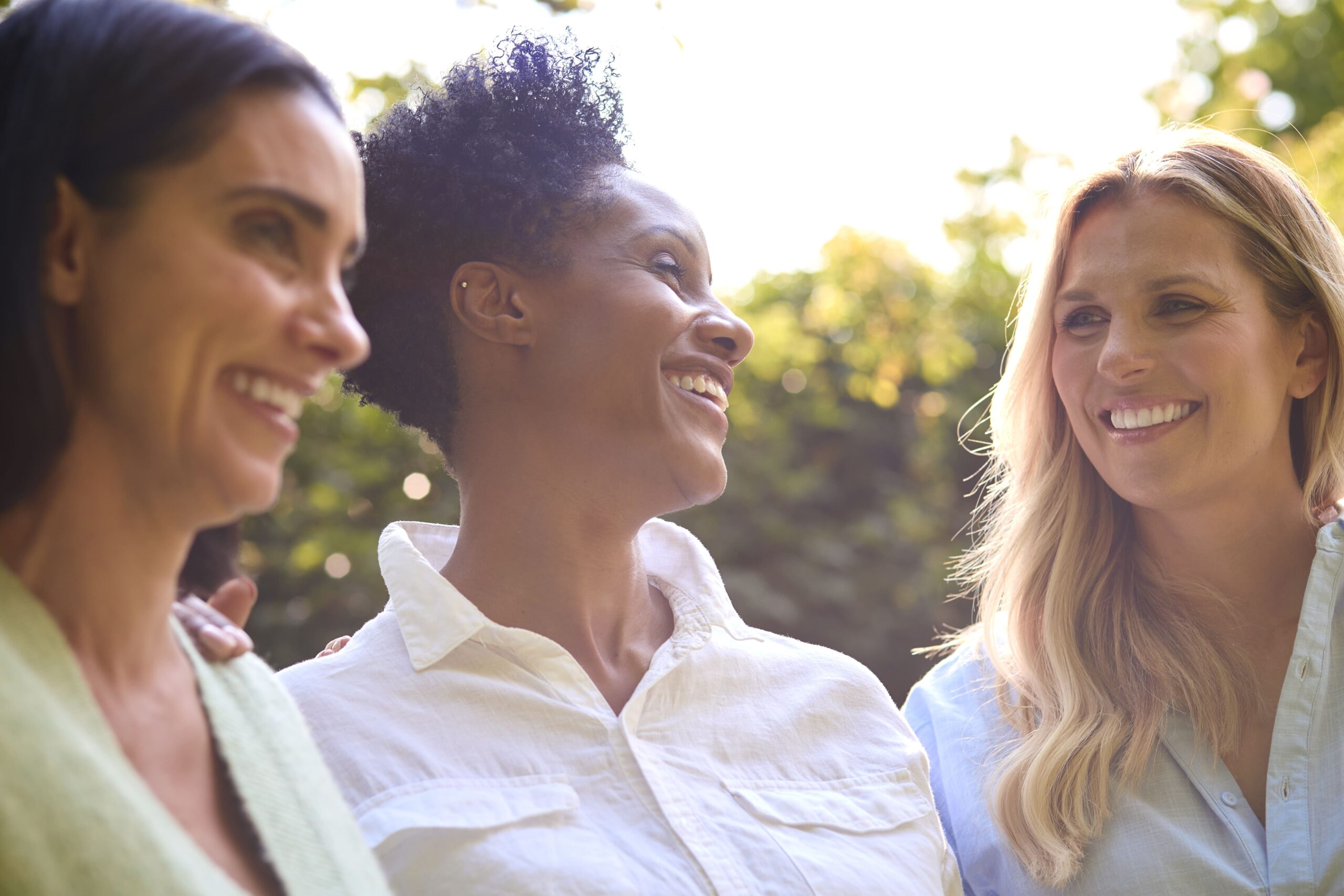 three smiling mature female friends outdoors spend 2024 10 19 07 48 22 utc min scaled 1