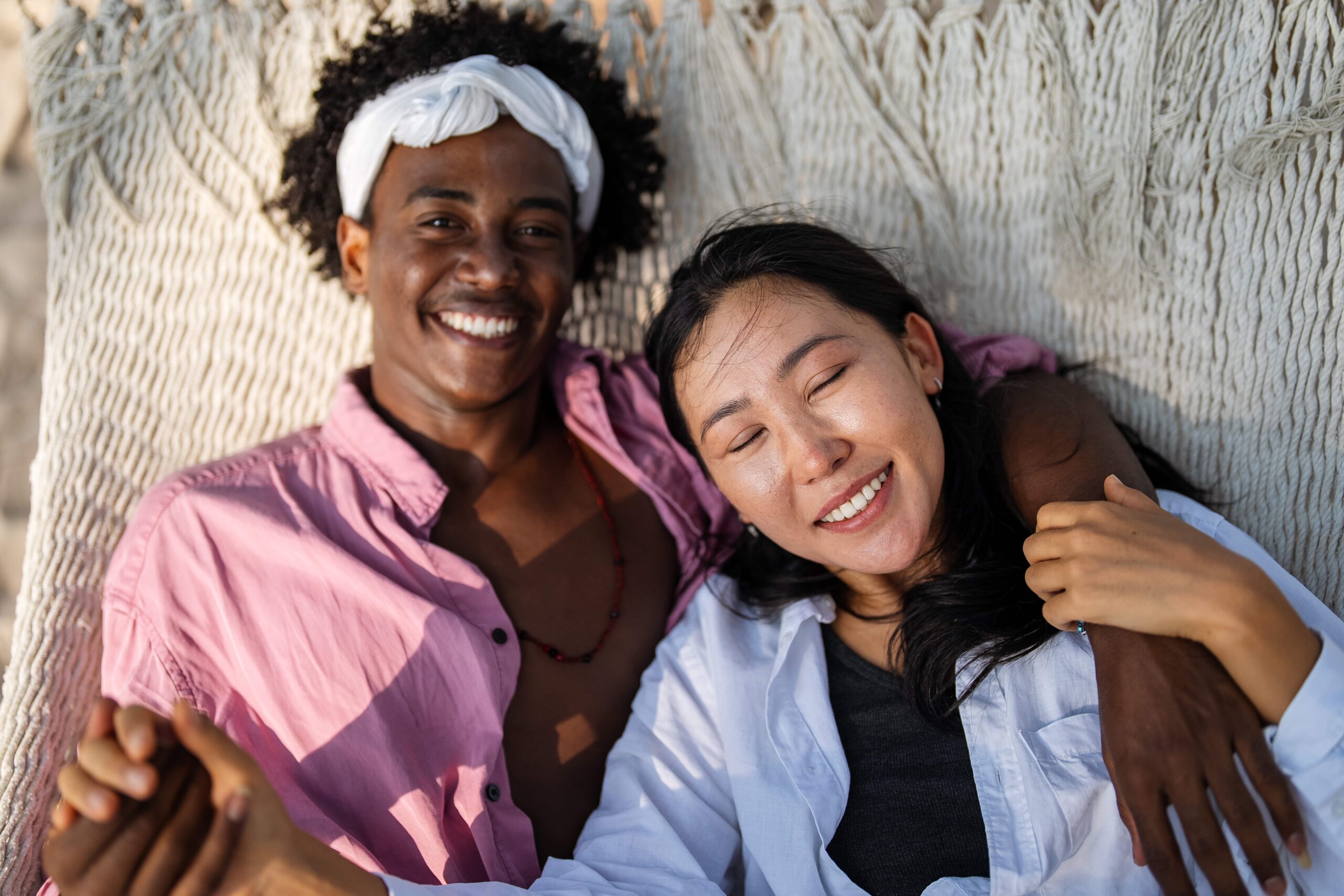 interracial couple enjoying a romantic beach getaw 2025 04 29 18 01 19 utc min scaled 1