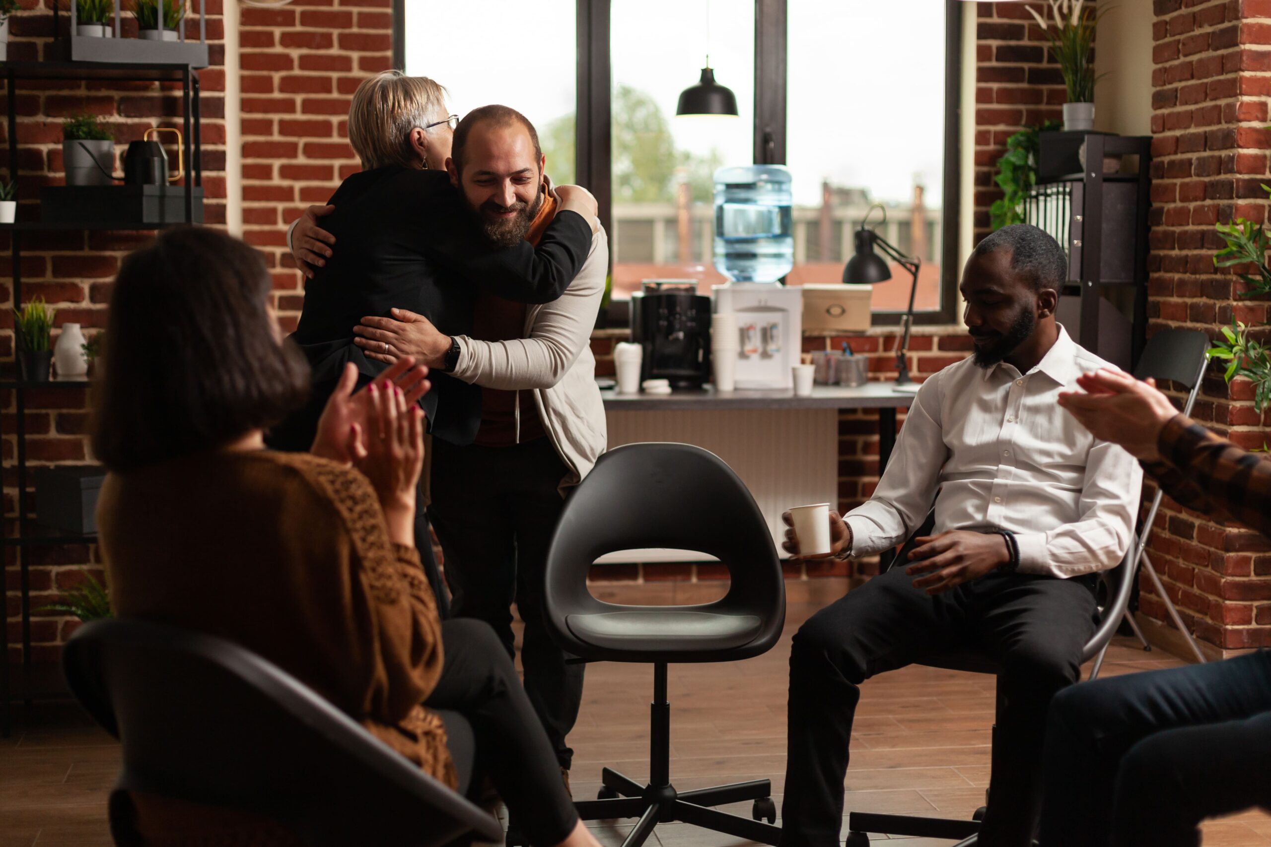 psychologist giving hug to man after sharing recov 2025 02 25 03 49 47 utc min scaled 2